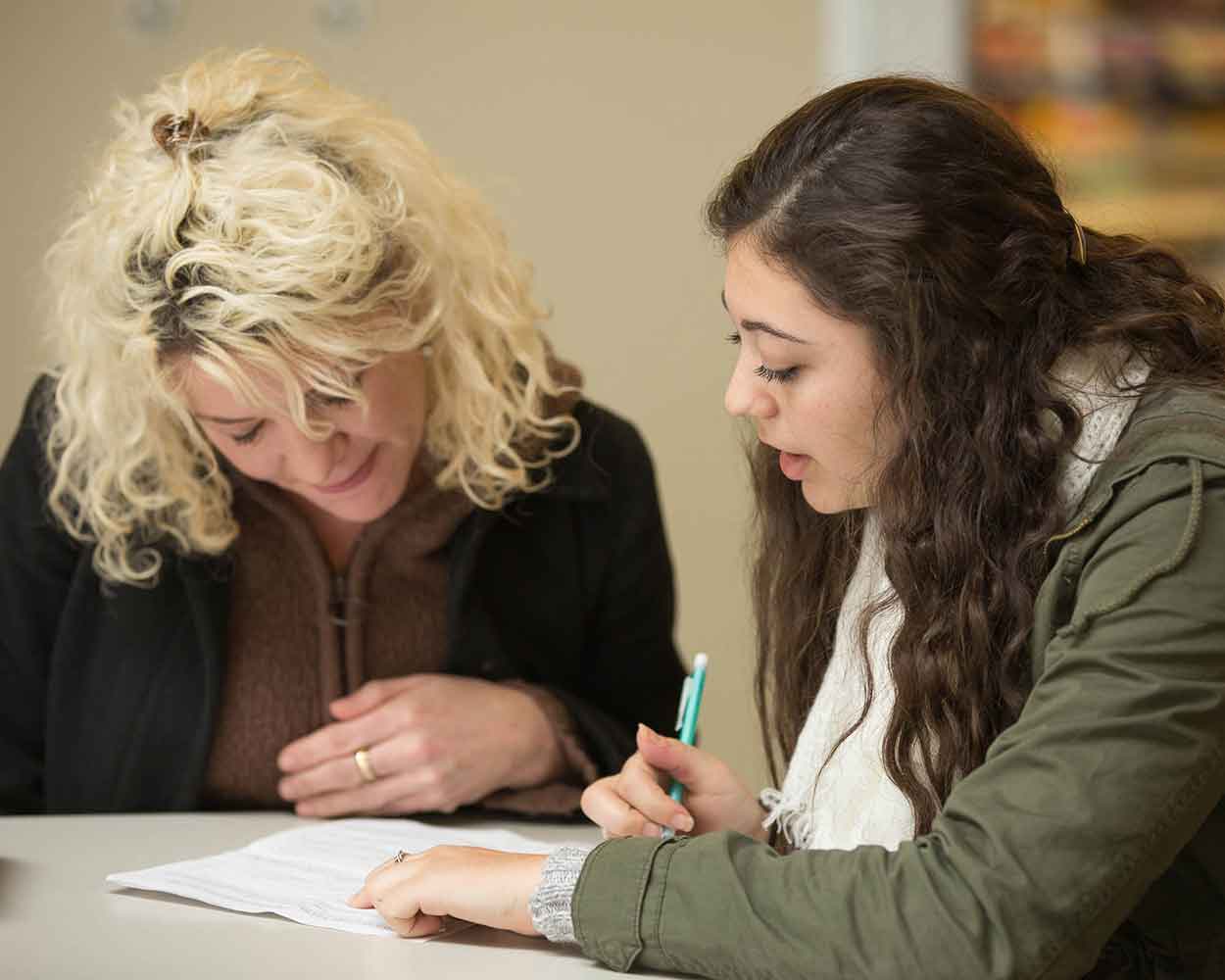 Students helping each other in class